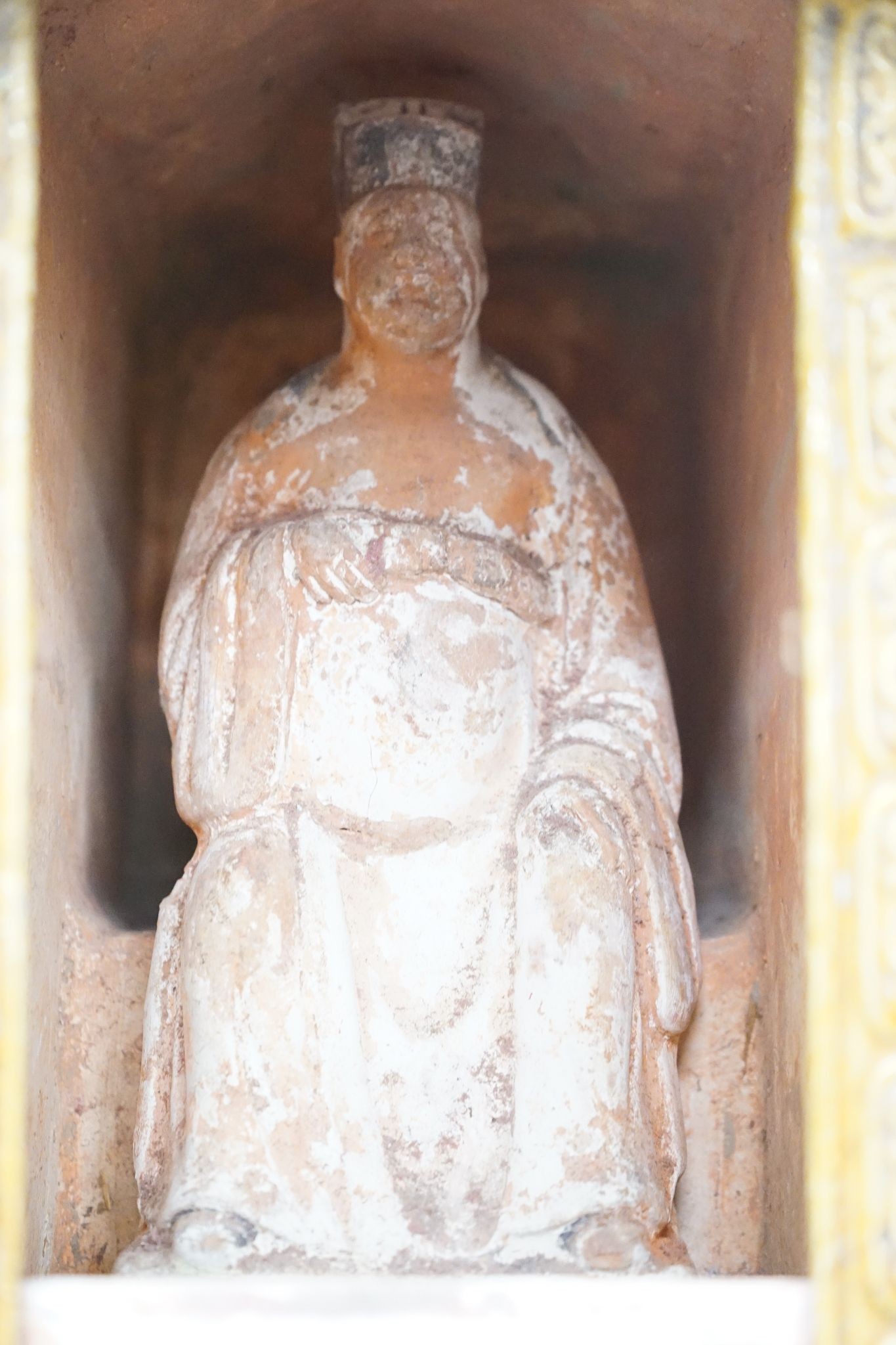 A Chinese Ming sancai-glazed model of a sedan chair with the figure Wenmu seated inside, 29cm